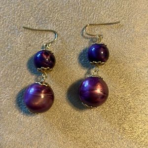 Purple bead gold tone dangle earrings.